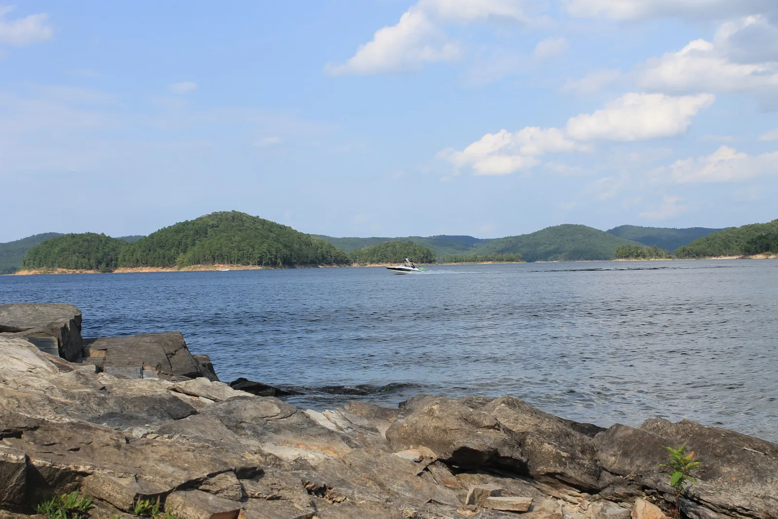 A group out on the clear water of Broken Bow Lake