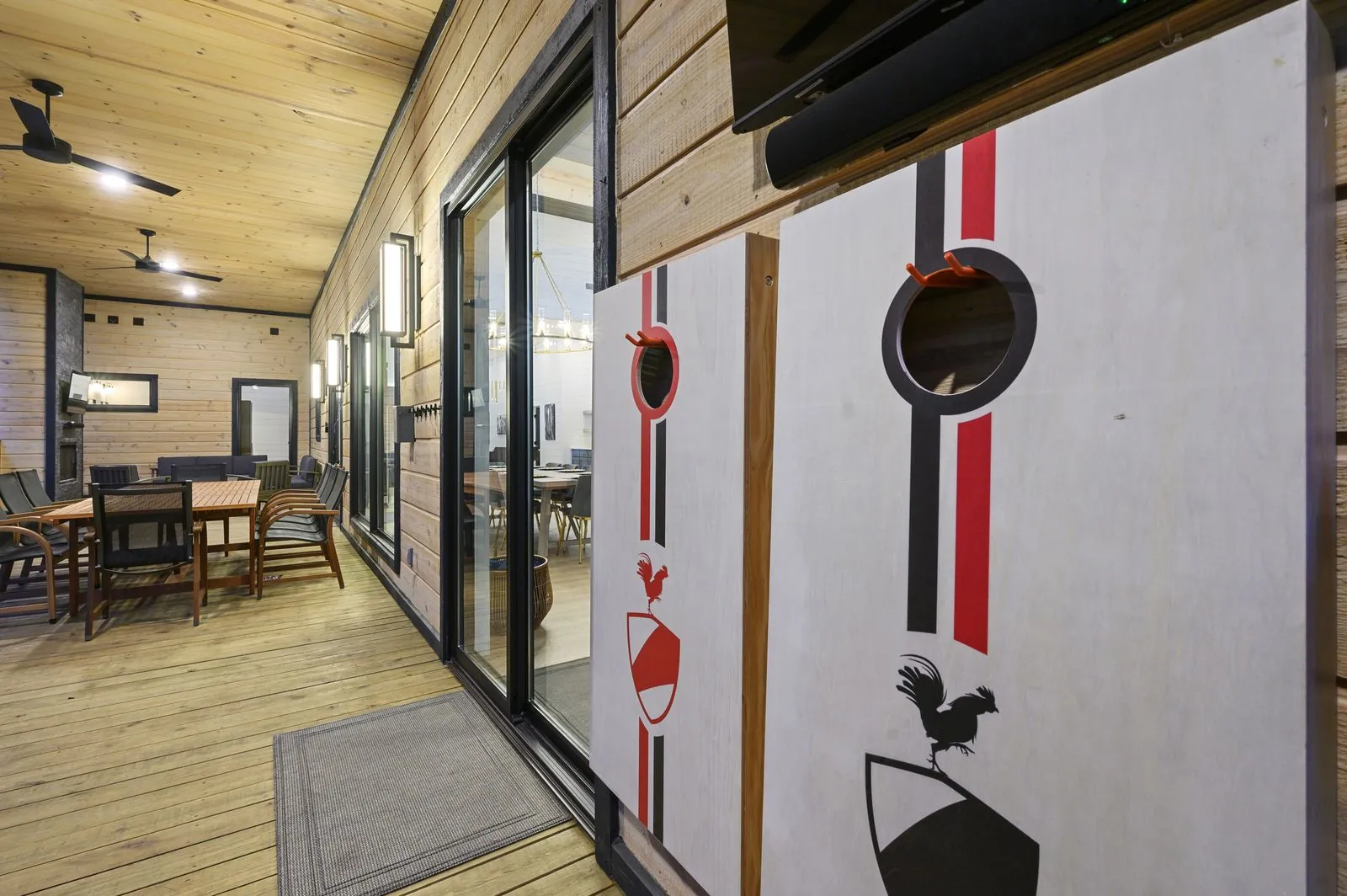 Hallway at The Arcadia with floor-to-ceiling windows and foosball table on covered deck