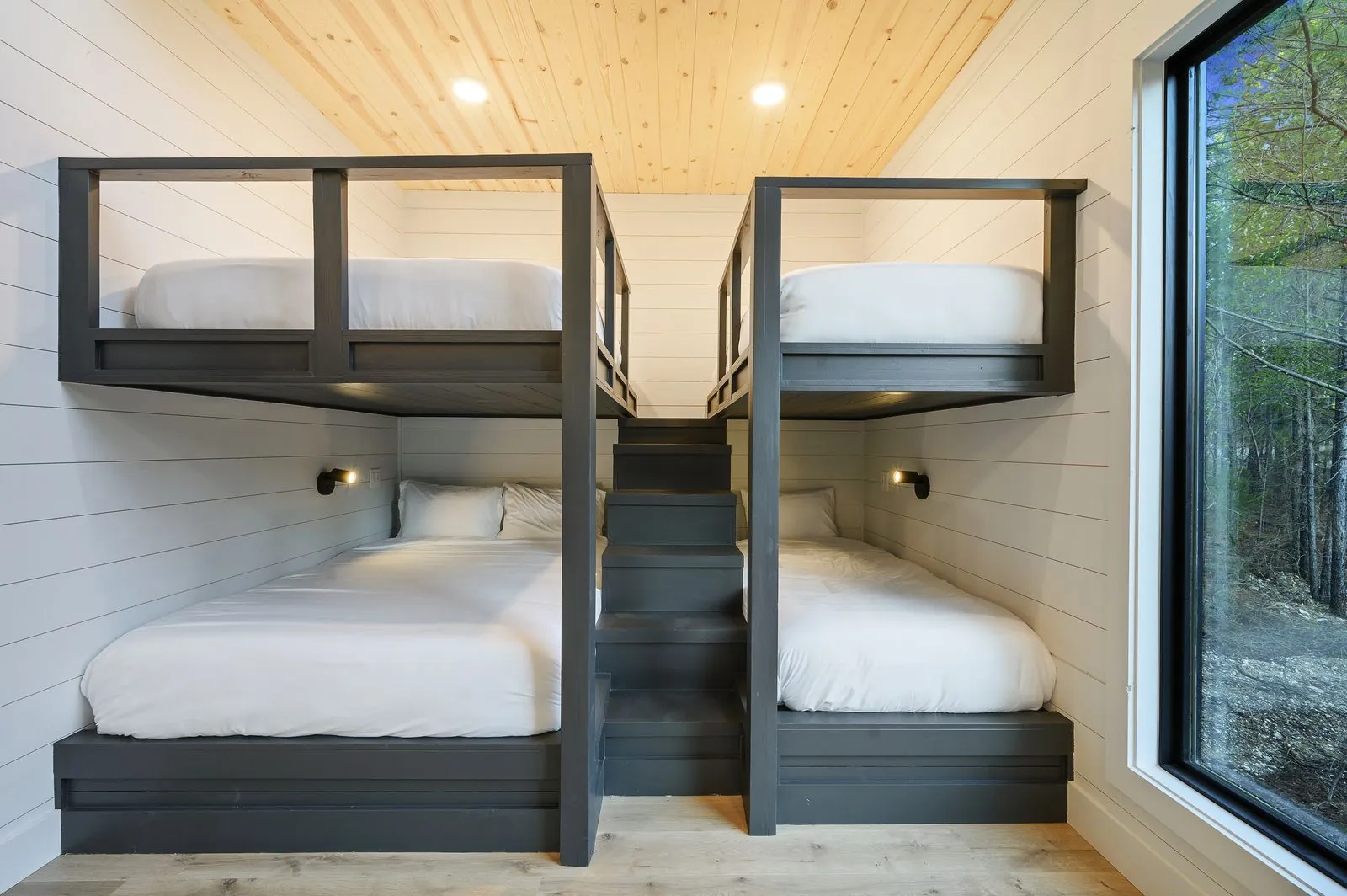 Bunk room corner at The Arcadia showing built-in bunk with ensuite bathroom entry