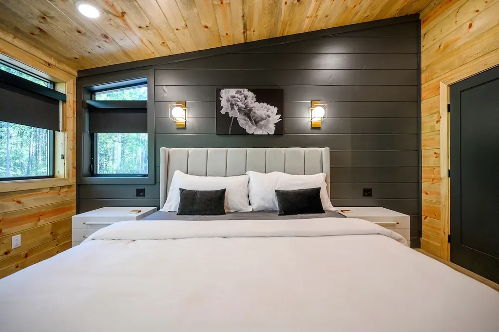King Bedroom 4 with gray headboard and white flower artwork