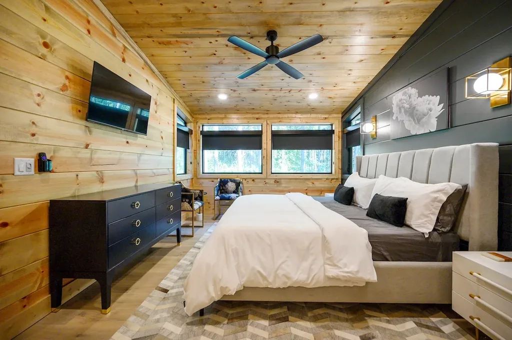 King Bedroom 4 with dresser and forest-view windows