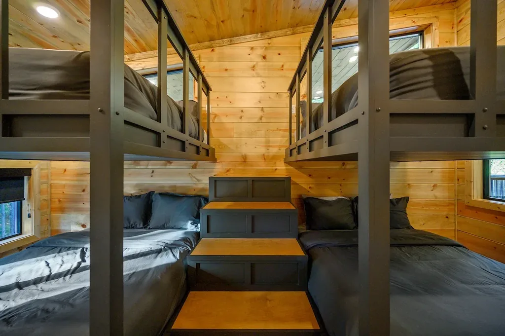 First built-in bunk bed with wide lower bunk and storage stairs