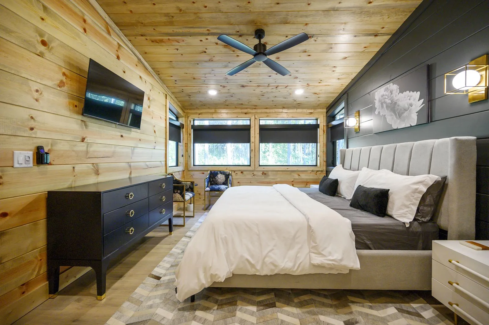 King suite 4 at The Avalon with an upholstered bed and wall-mounted TV
