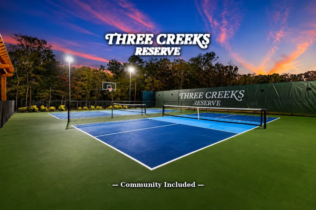 Three Creeks Reserve pickleball and basketball courts at dusk, included with stays at The Black-Beary