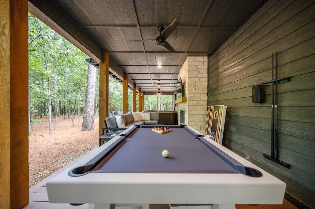 The Black-Beary — Rack up a game of pool on the covered patio, then settle into the sectional by the stone fireplace surrounded by trees.
