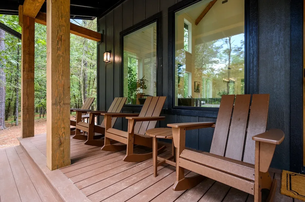 The Black-Beary — Unwind on the private covered porch, where a row of rocking chairs looks out over quiet, tree-lined surroundings.
