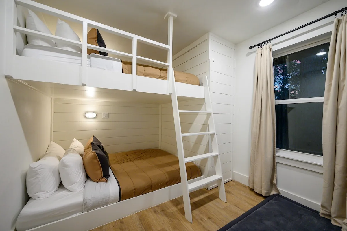 Upstairs bunk room with two queen beds