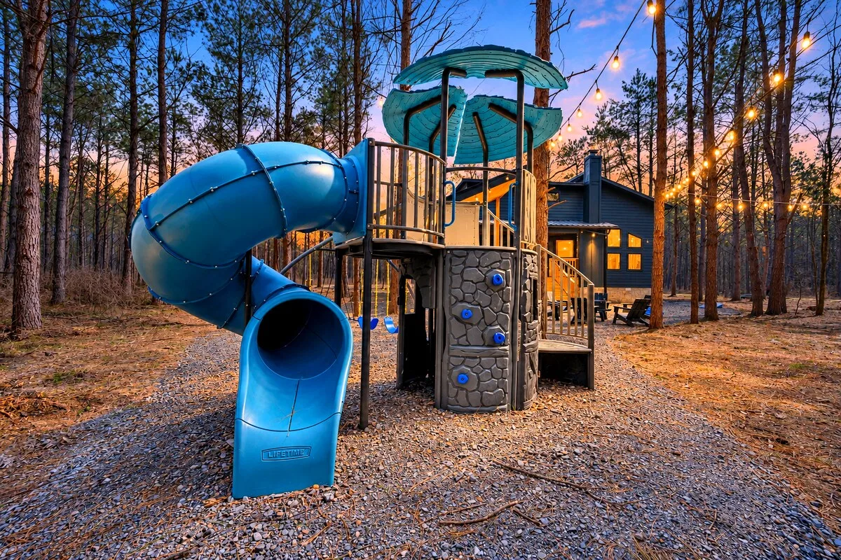 Blue Note — Kids can climb, slide, and swing right in the private backyard, steps from the cabin's own porch and fire pit area.