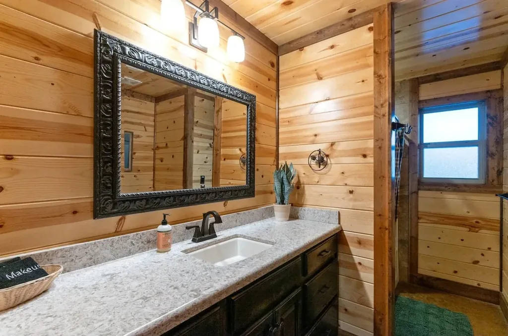 Illuminated vanity in full bathroom 1 at Cami's Campout