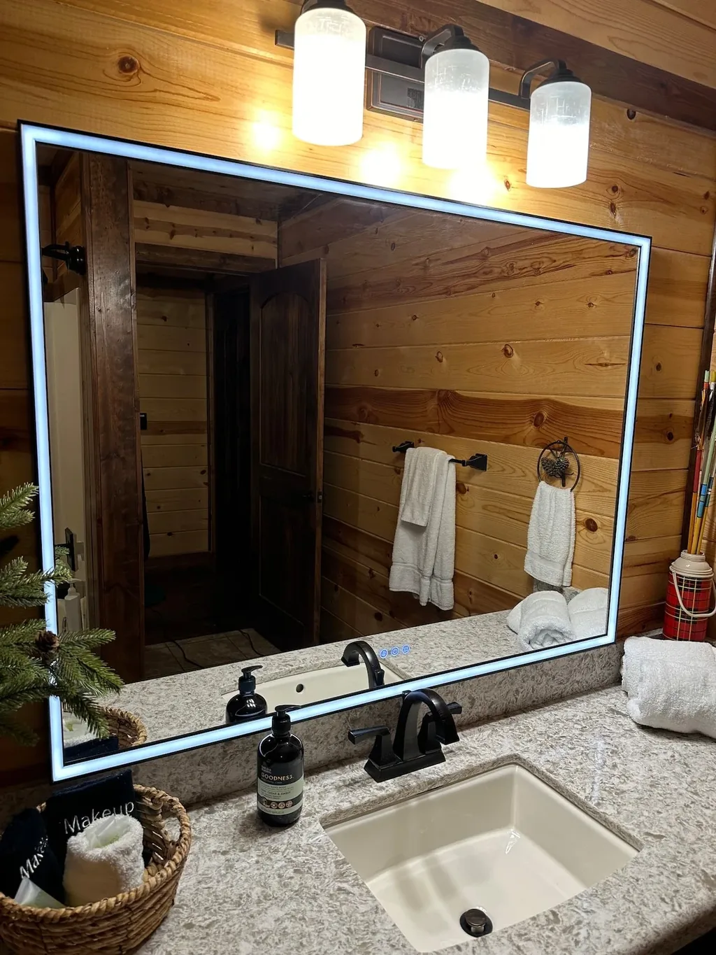 Illuminated vanity in full bathroom 3 at Cami's Campout