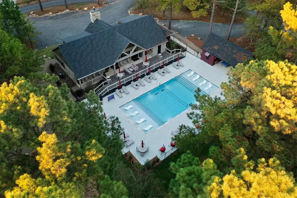 Dolce Far Nient — Guests can cool off in the shared resort pool, complete with loungers and shaded seating, included at no extra cost.