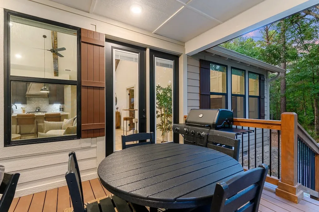 Dolce Far Nient — Step outside to a private covered patio with your own gas grill and dining table for four, surrounded by trees.