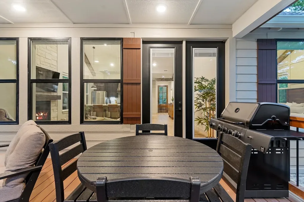 Dolce Far Nient — Step out to a covered patio set up for outdoor dining and grilling just steps from the kitchen.