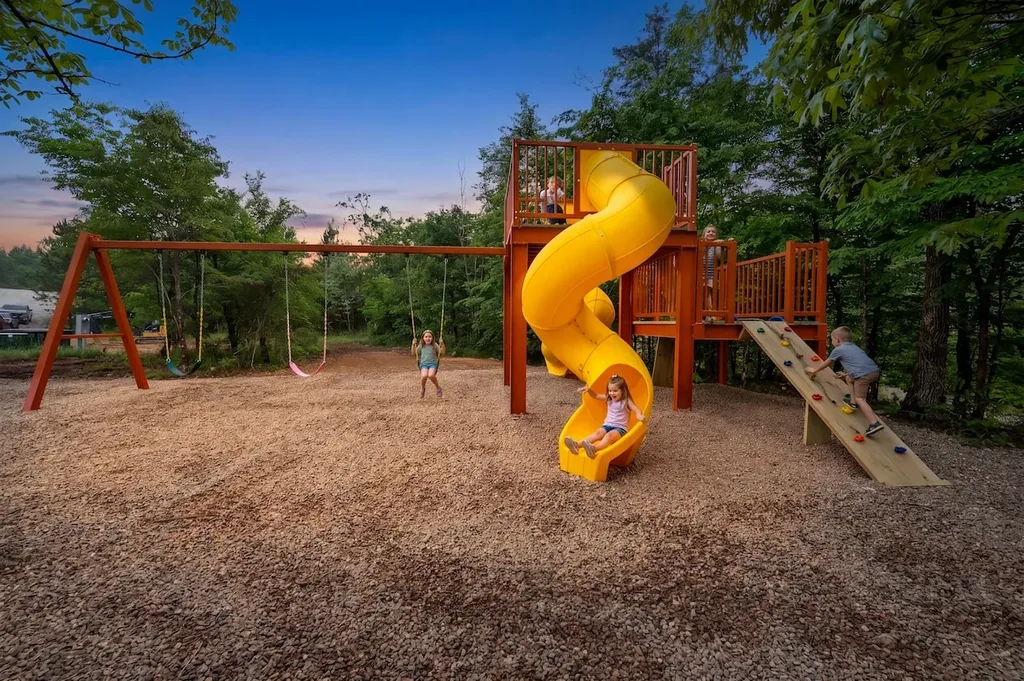 Children enjoying the custom playground at Dreams & Streams