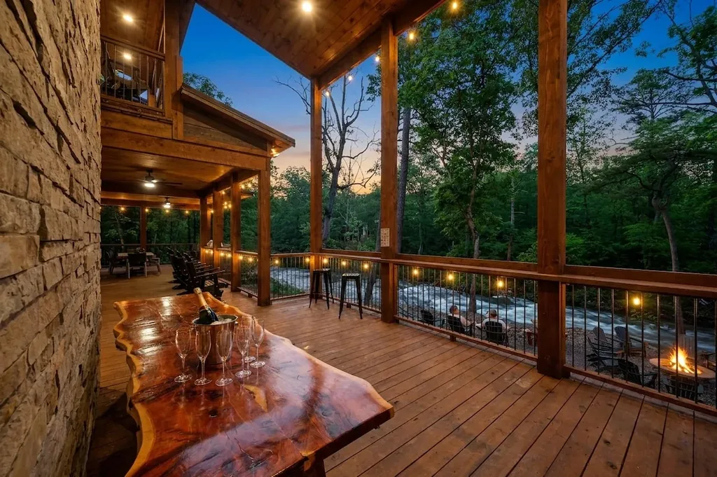 Creekside deck with a live-edge bar at Dreams & Streams