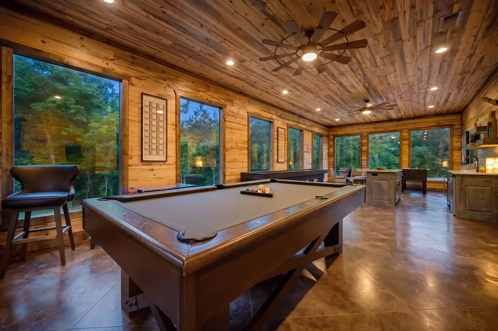 Game room with pool table and forest views at Dreams & Streams