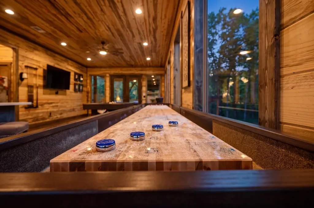 Shuffleboard table in the Dreams & Streams game room