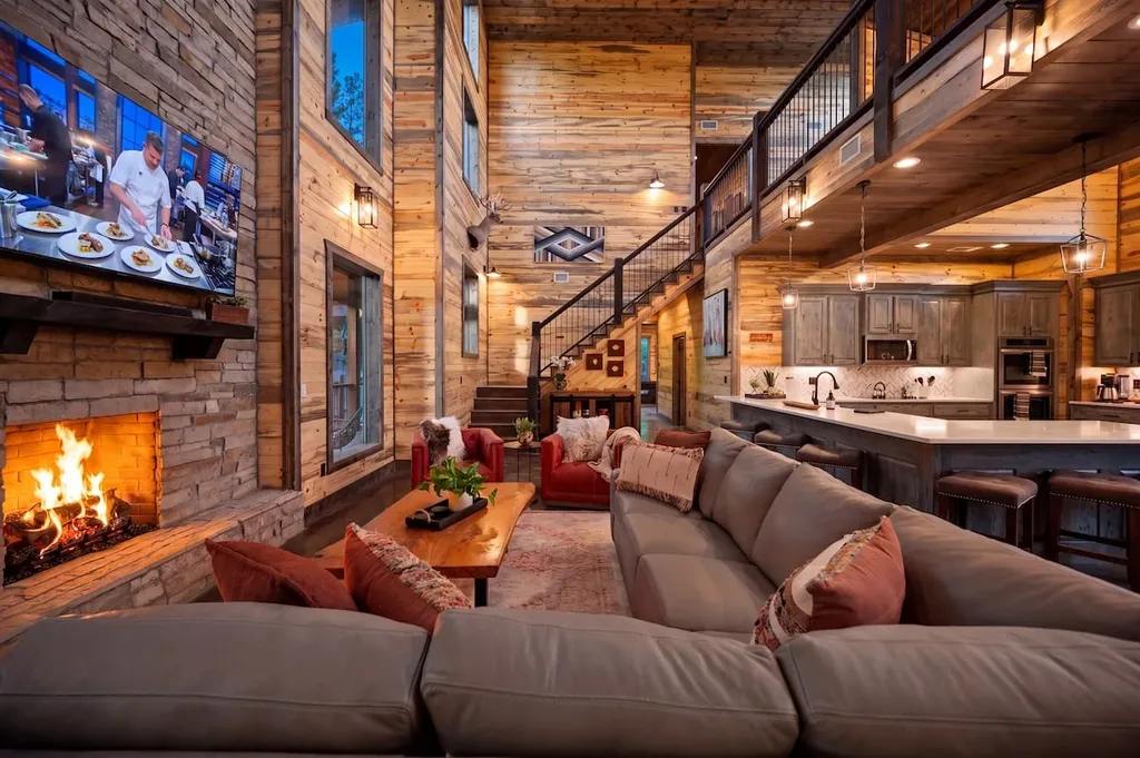 Great room seating, fireplace, and kitchen at Dreams & Streams