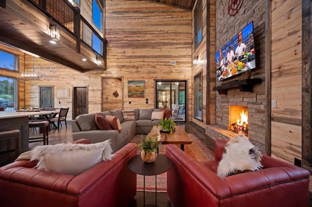 Great room seating around the stone fireplace at Dreams & Streams