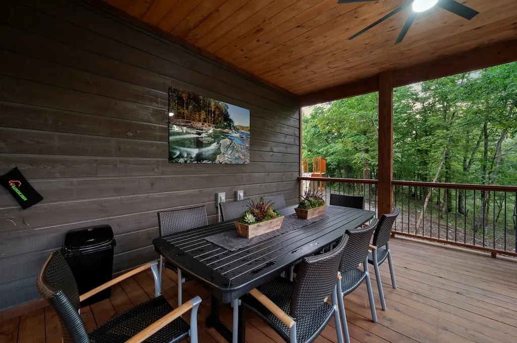 Covered outdoor dining area overlooking the forest
