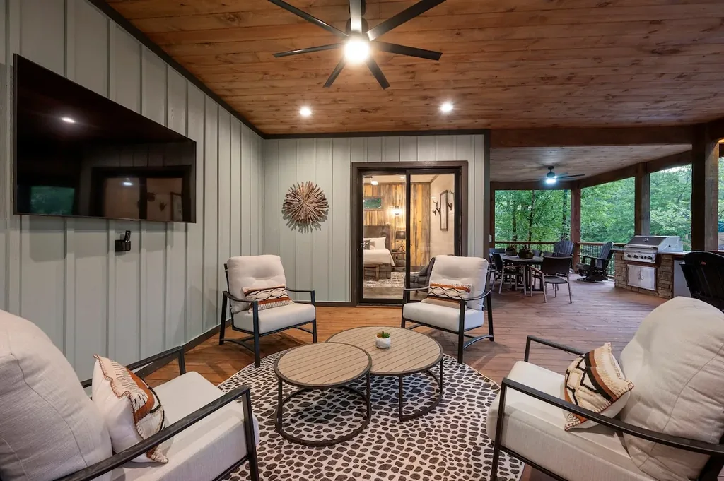 Covered deck lounge connected to the outdoor kitchen