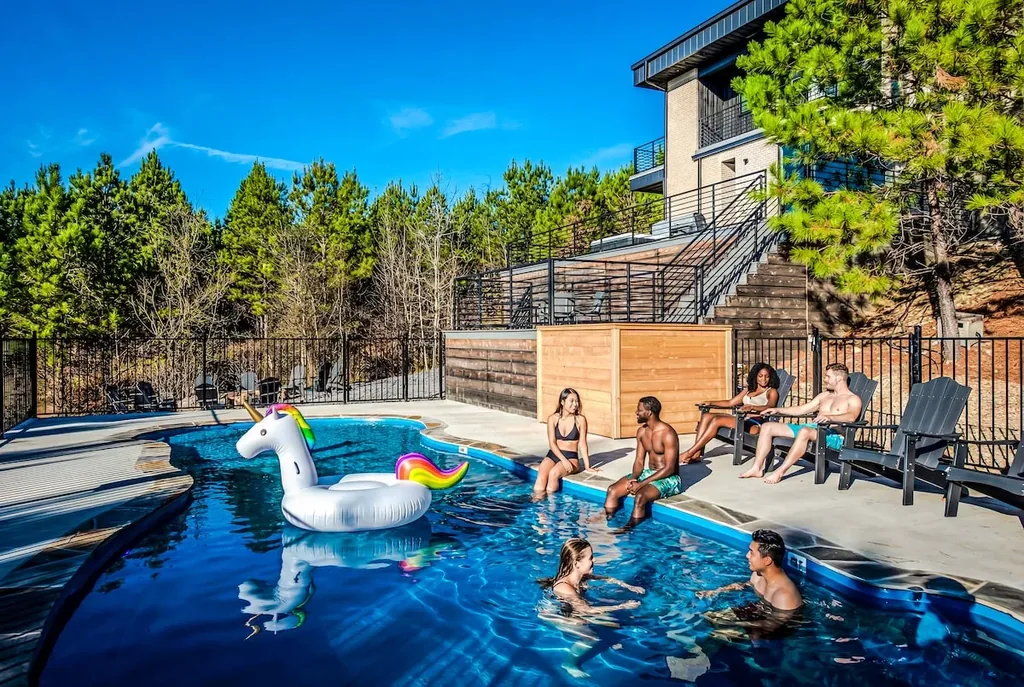 Guests enjoying The Jade's private pool overlooking the forest