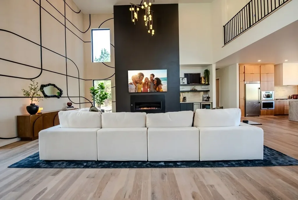 Living room seating facing the fireplace and television