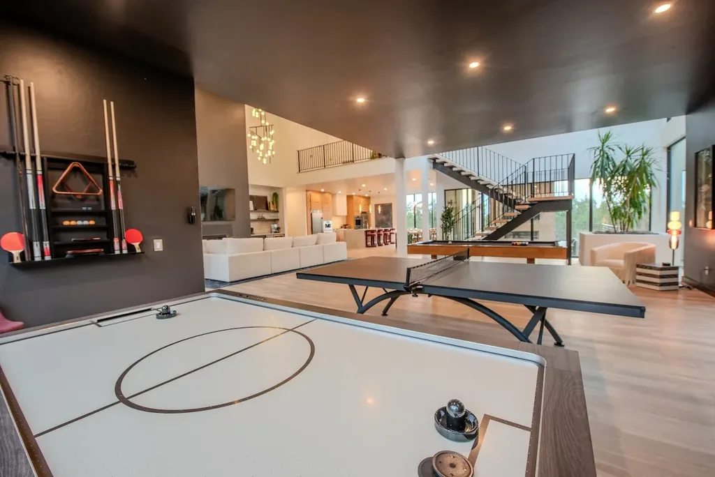 Air hockey and ping-pong tables in The Jade game room