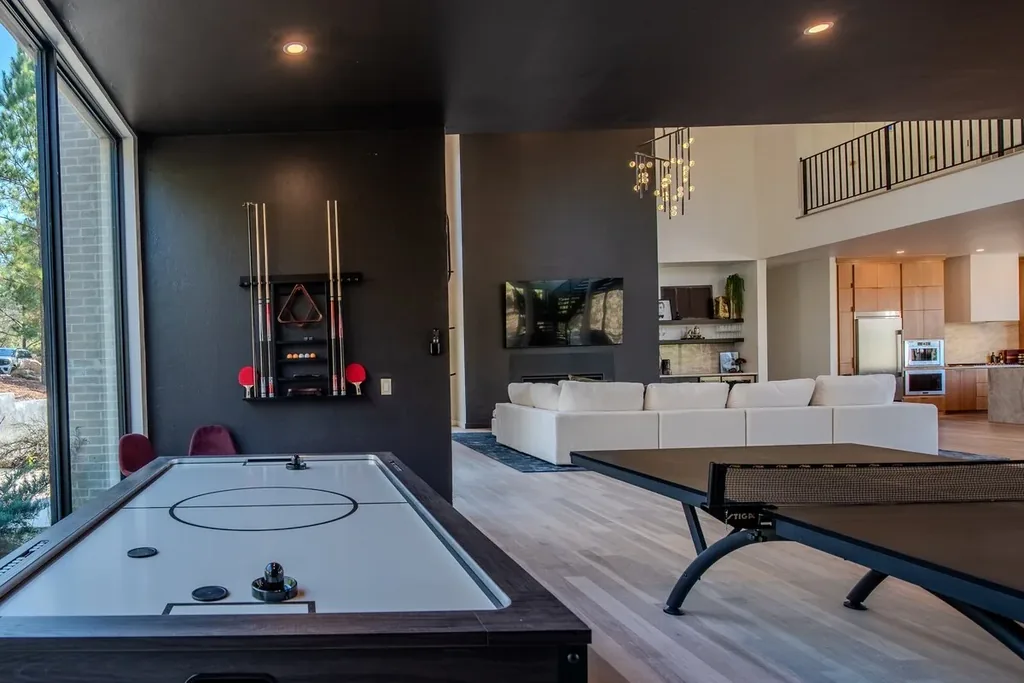 Air hockey and ping-pong tables beside the living room