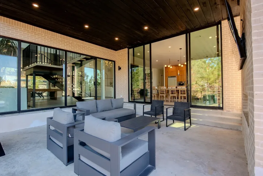 Covered outdoor lounge on The Jade's forest-facing deck