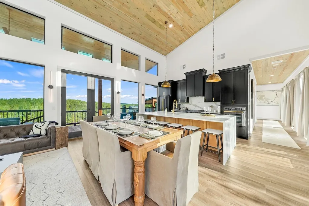 Open dining, kitchen, and living-room panorama at The Malibu