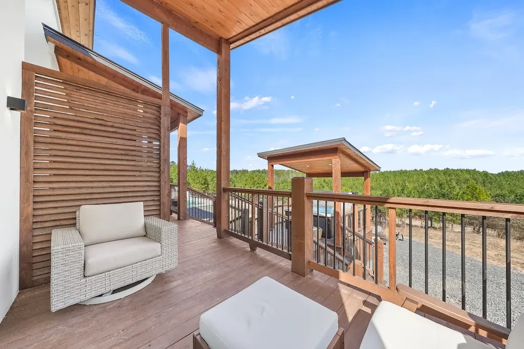 Second balcony view outside King Bedroom 1 toward the hot tub pavilion
