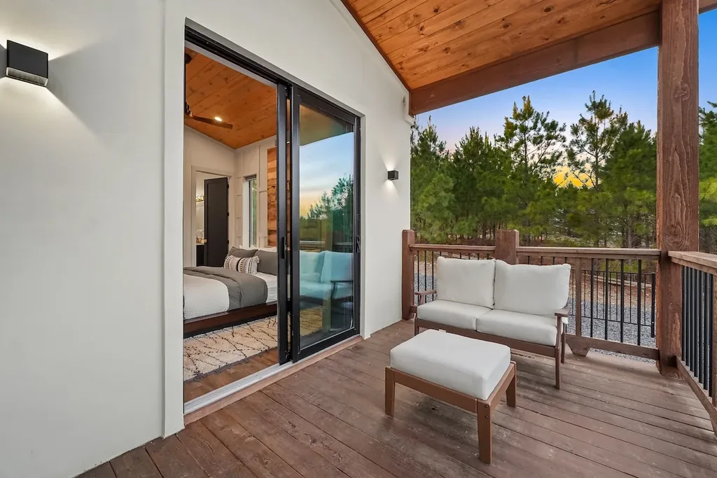 Private covered balcony outside King Bedroom 2 with lounge seating