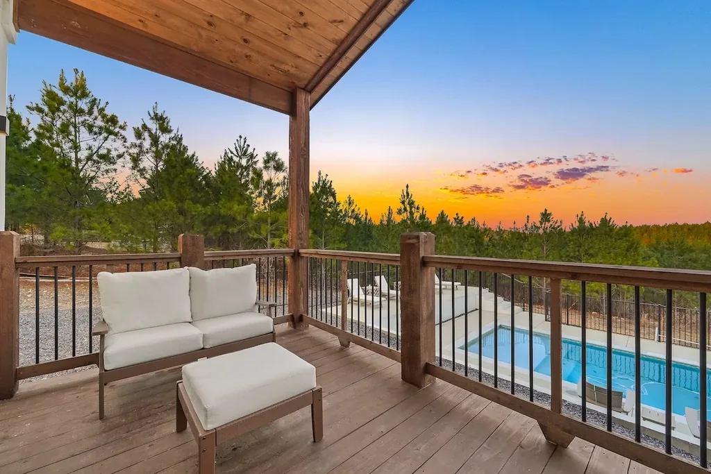 King Bedroom 2 balcony overlooking the pool and forest