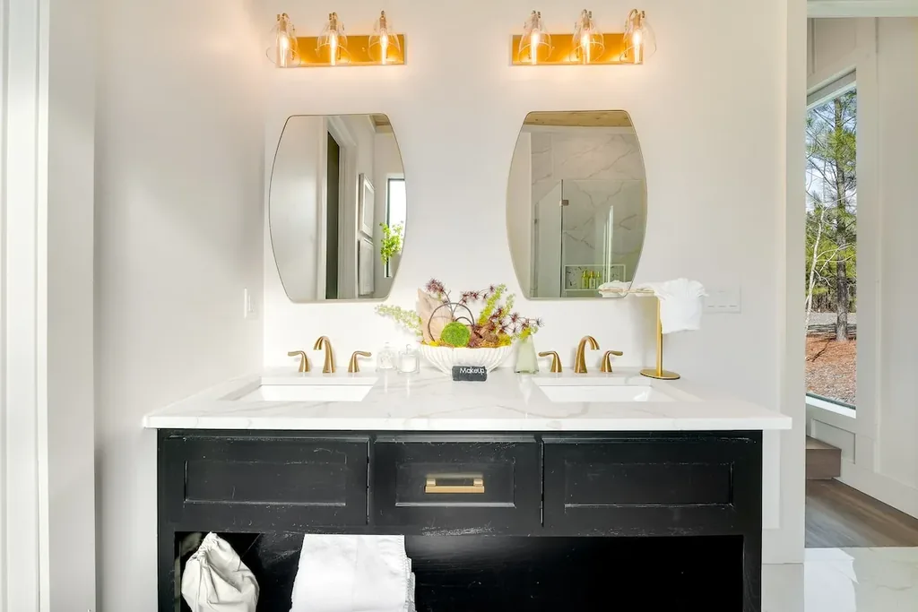 Full Bathroom 1 double vanity with black cabinetry