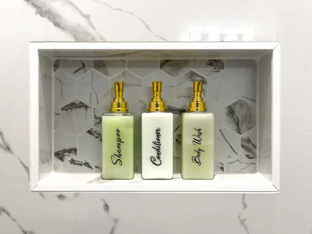 Shampoo, conditioner, and body wash in the Full Bathroom 4 shower niche