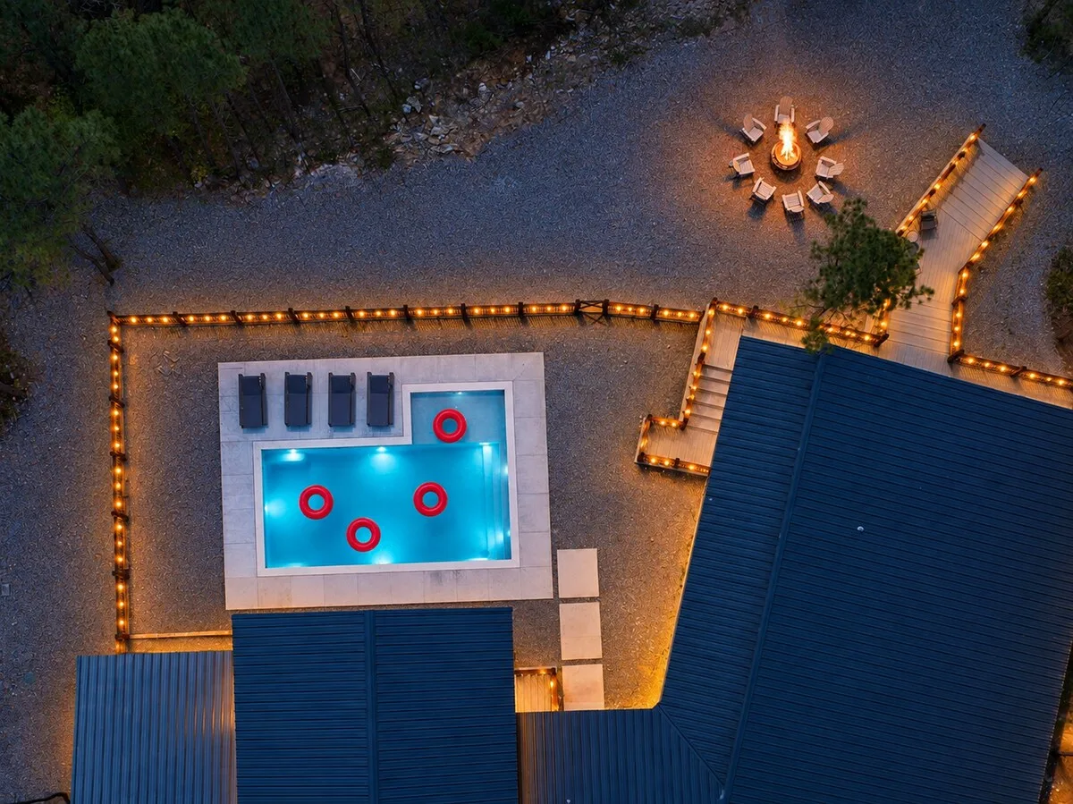 Private pool and fire pit at Miko Chukka after dark