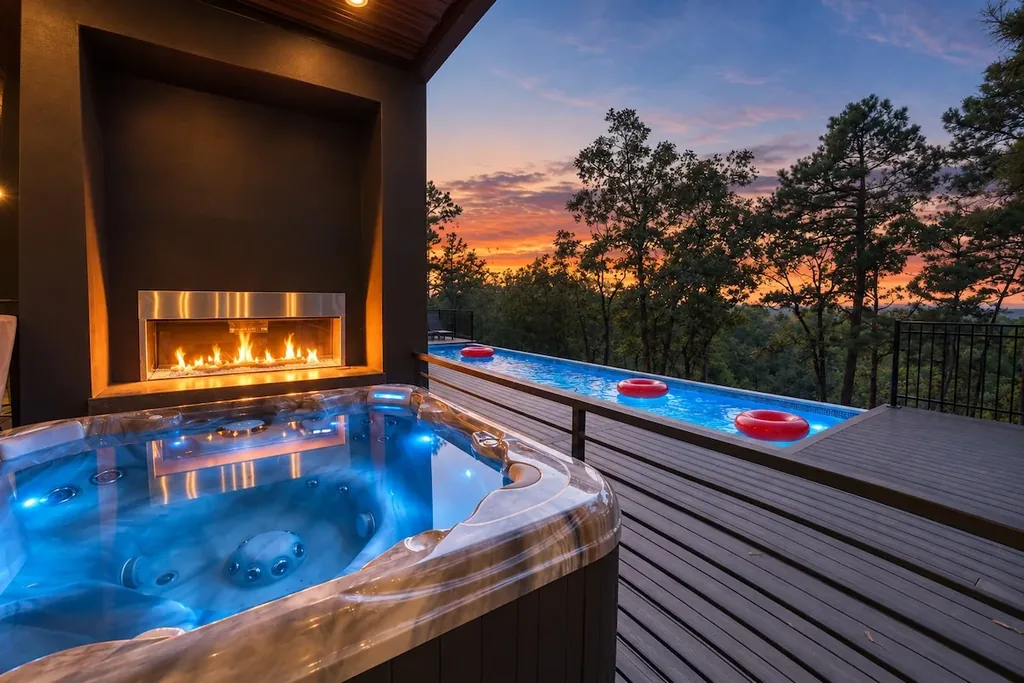 Sanctuary at the Summit — Soak in your private hot tub by the fireplace while the sun sets over the pool and the hills beyond.