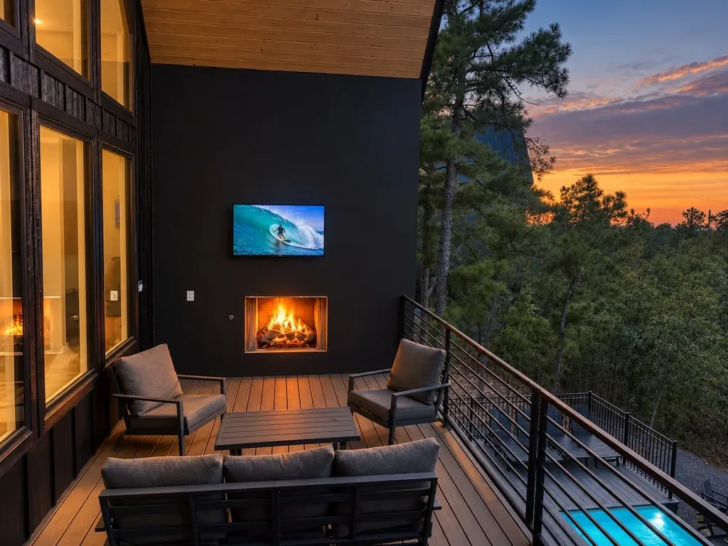 Sanctuary at the Summit — Watch the sunset over the trees from your private deck, warmed by a gas fireplace with a TV built right in.